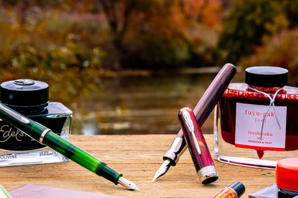 Fountain pens and ink bottles.