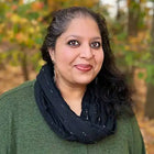 Woman with graying hair and black scarf.