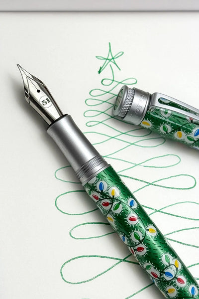 Green floral fountain pen with silver accents and cap, likely a montblanc model.