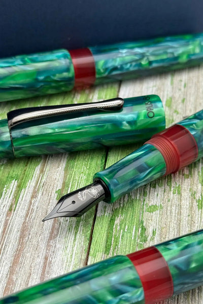 Green and red marbled fountain pen with a sleek design, likely from the omas brand.